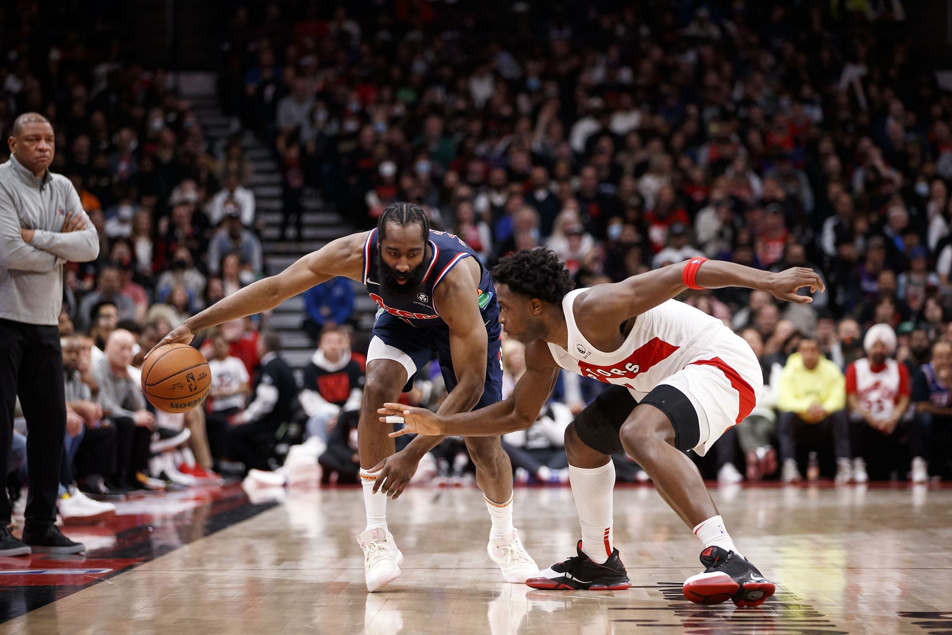 James Harden attempts to dribble past OG Anunoby