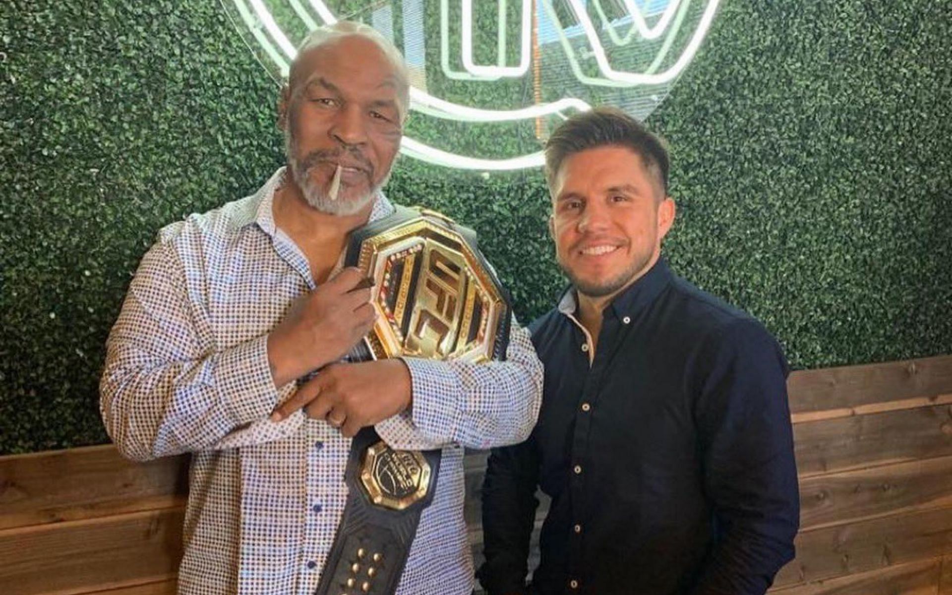 Mike Tyson (left) with Henry Cejudo [Image Courtesy: @MikeTyson on Twitter]