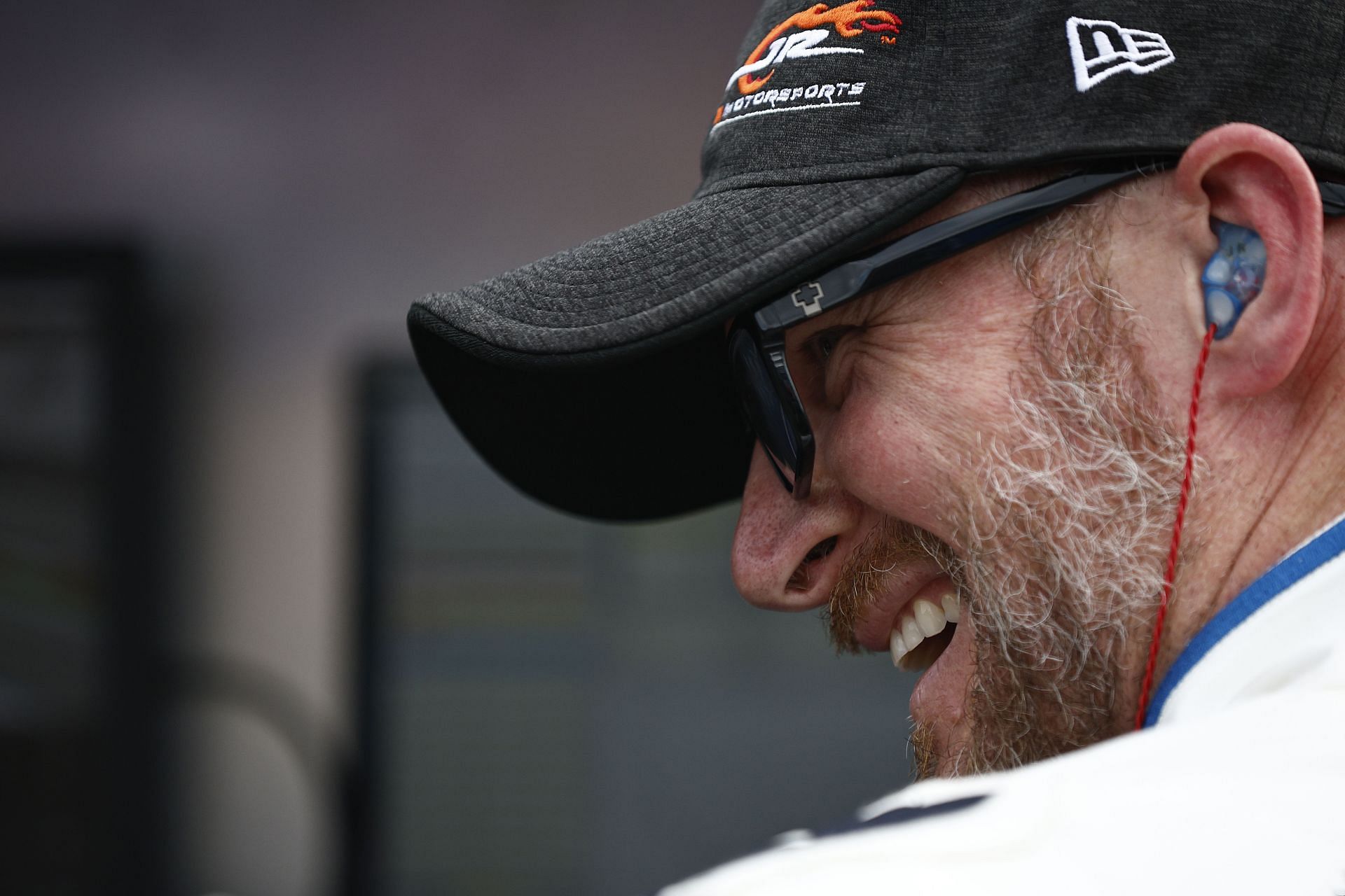 Dale Earnhardt Jr laughs on the grid during qualifying for the NASCAR Xfinity Series Call 811 Before You Dig 250 powered by Call 811.com at Martinsville Speedway.