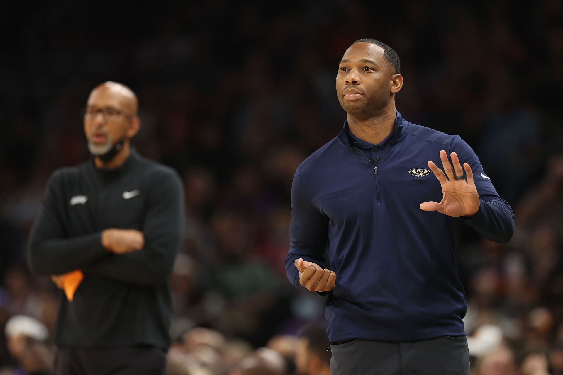 Head coaches Willie Green (R) of the New Orleans Pelicans and Monty Williams of the Phoenix Suns