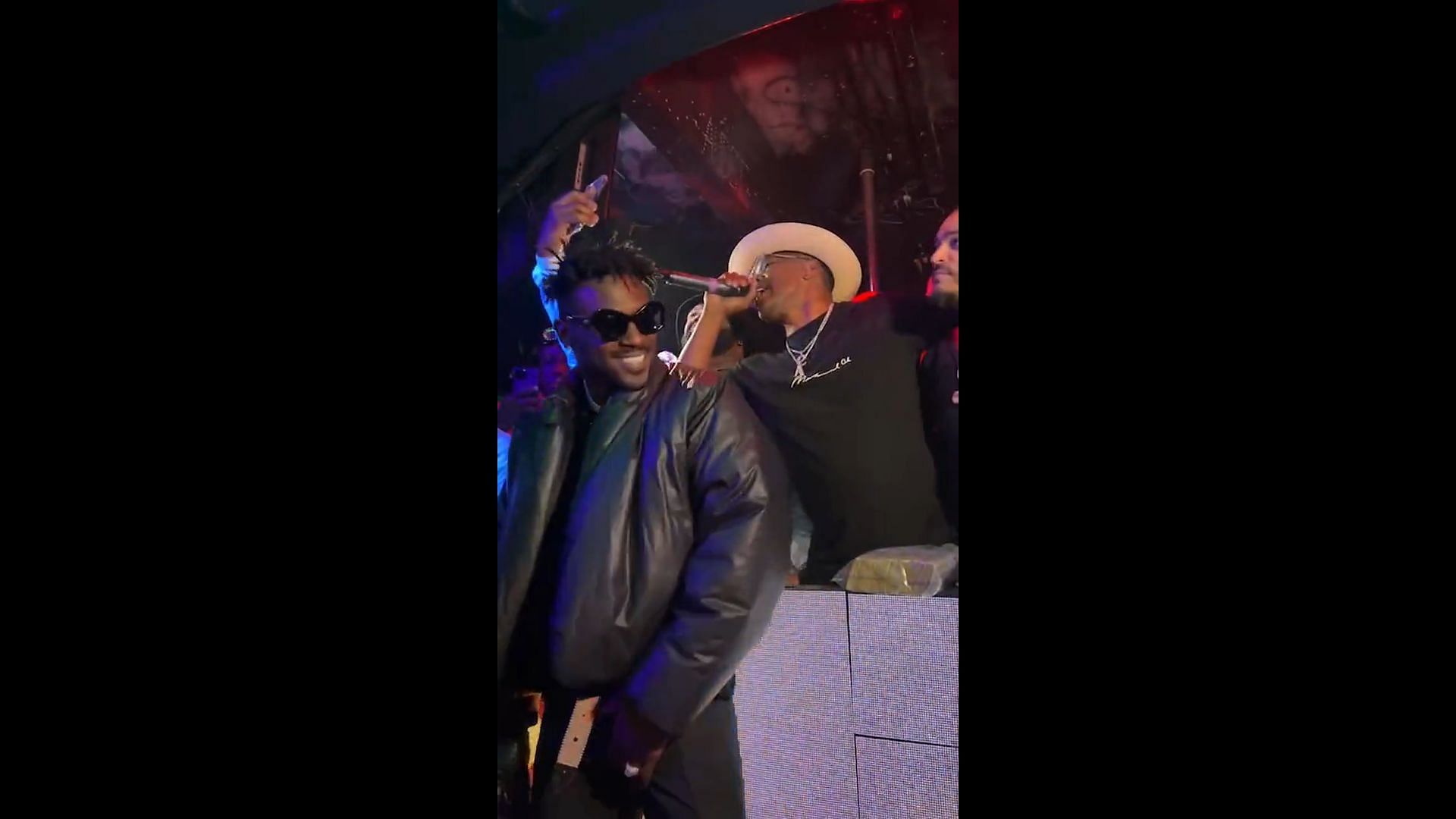 Brown with actor Jamie Foxx at a Miami strip club