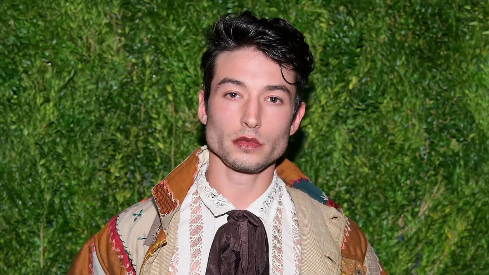 Ezra Miller was arrested on March 28 after he became agitated when people in a pub started singing karaoke. (Image via Getty Images/Roy Rochlin)