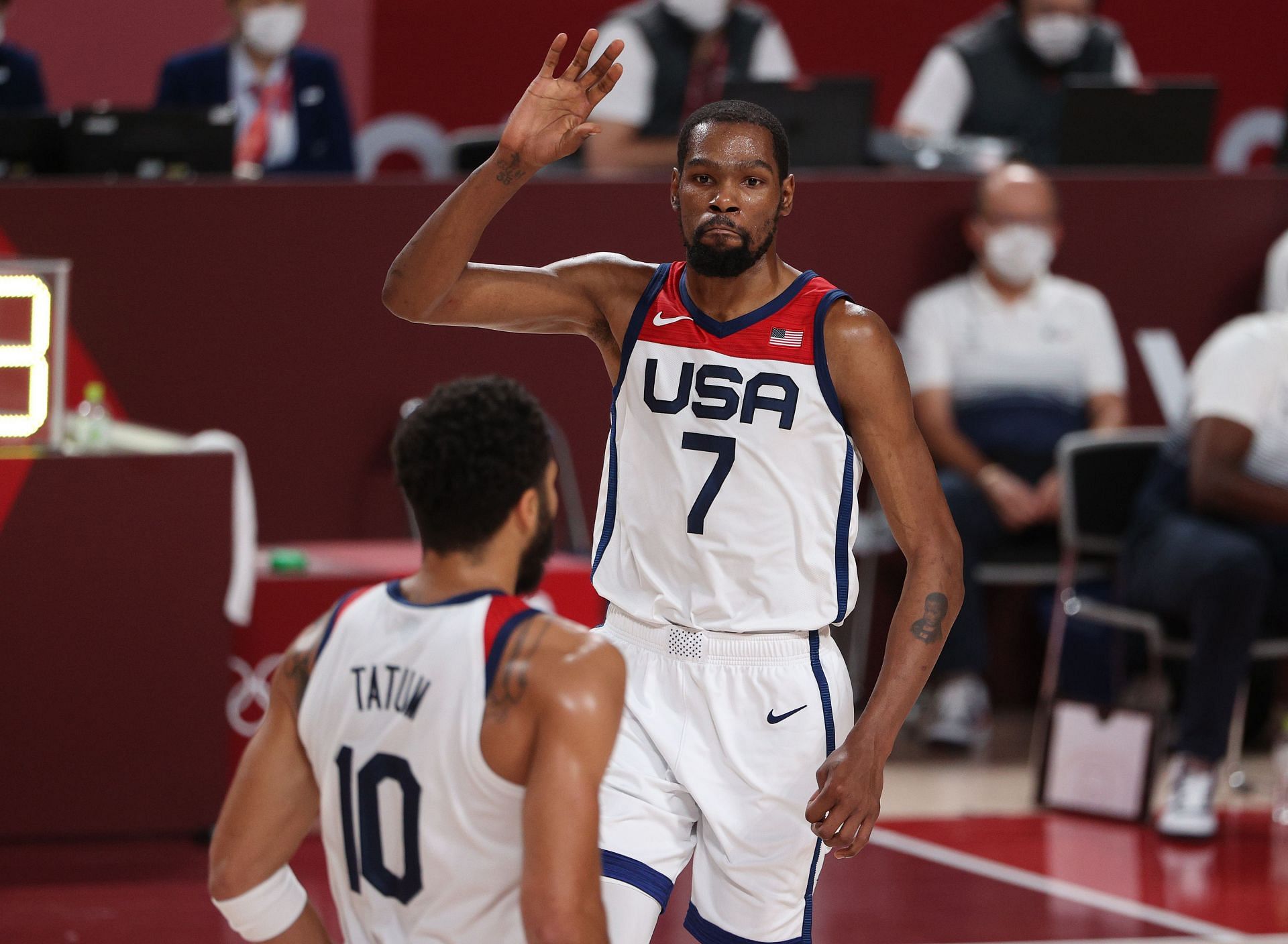 Kevin Durant (7) of Team USA high-fives teammate Jayson Tatum during the men&#039;s basketball final with Team France at the Olympics on Aug. 7, 2021, in Saitama, Japan.