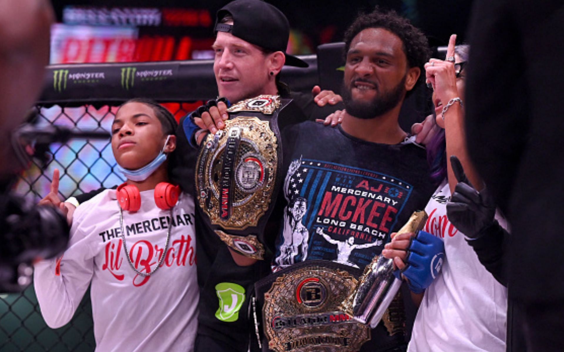 AJ McKee holding his Bellator title (Images via Getty)