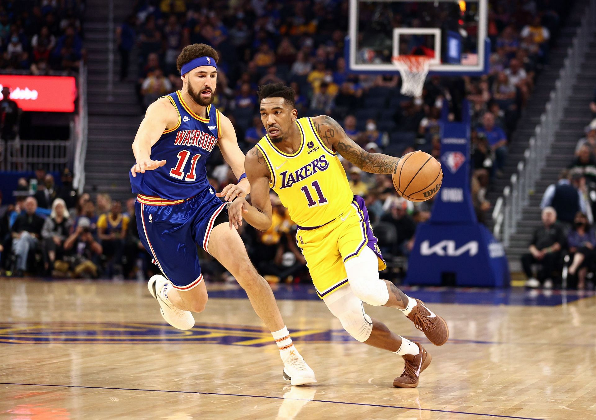 Malik Monk #11 of the Los Angeles Lakers is guarded by Klay Thompson #11 of the Golden State Warriors