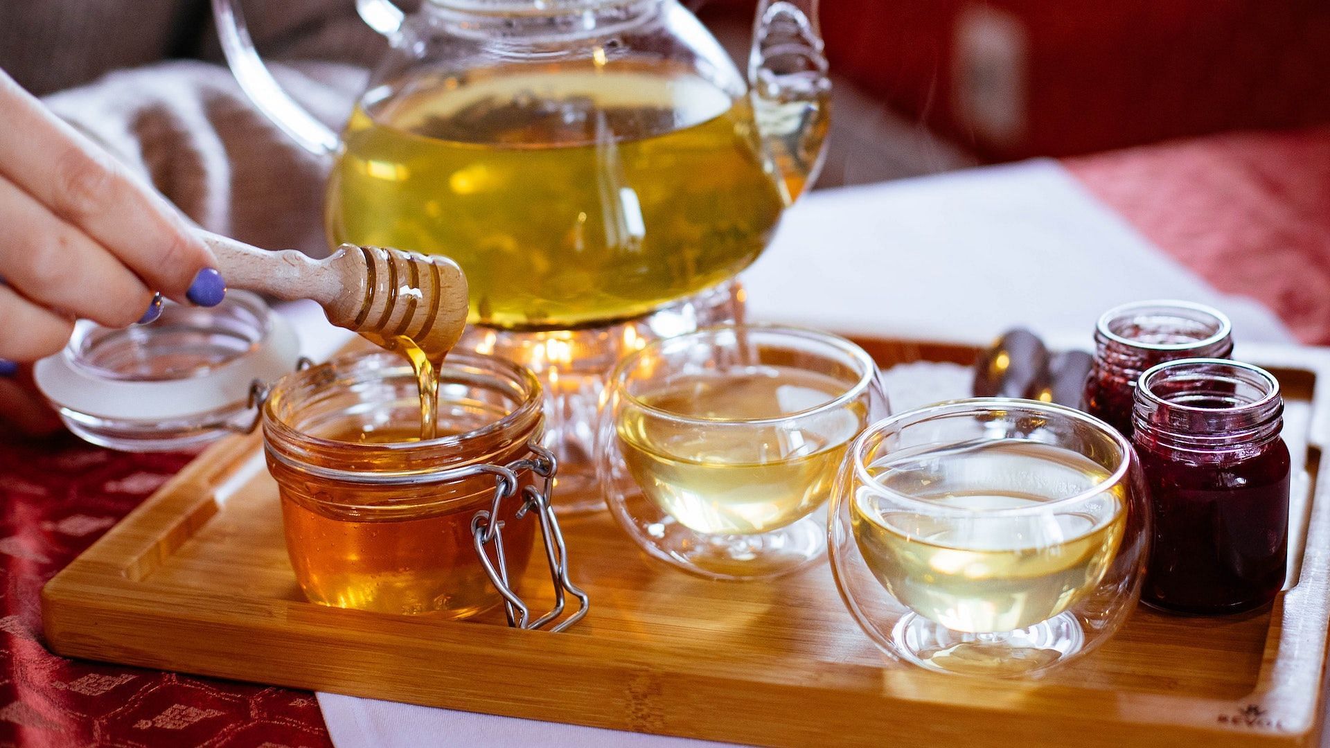 Honey is used to treat sore throats. Image via Pexels/Valeria Boltneva