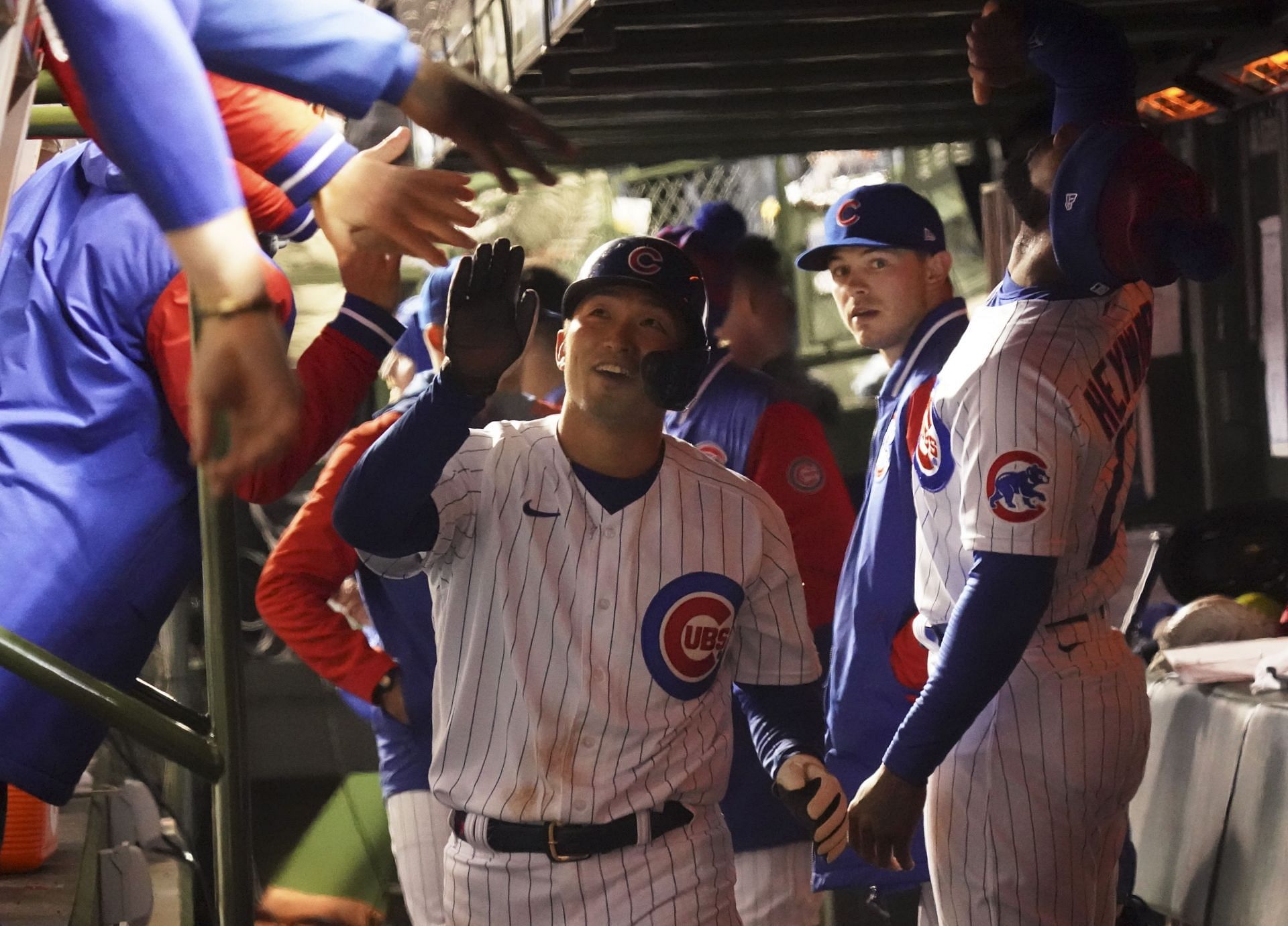 Cubs star Suzuki celebrates with teammates after a dinger against the Tampa Bay Rays