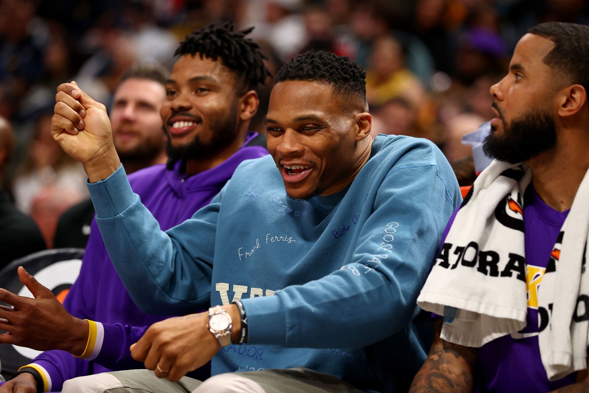 Russell Westbrook of the Los Angeles Lakers laughs on the bench.