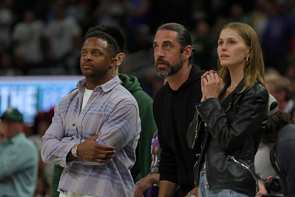 Green Bay Packers teammates Randall Cobb, Aaron Rodgers, and Mallory Edens