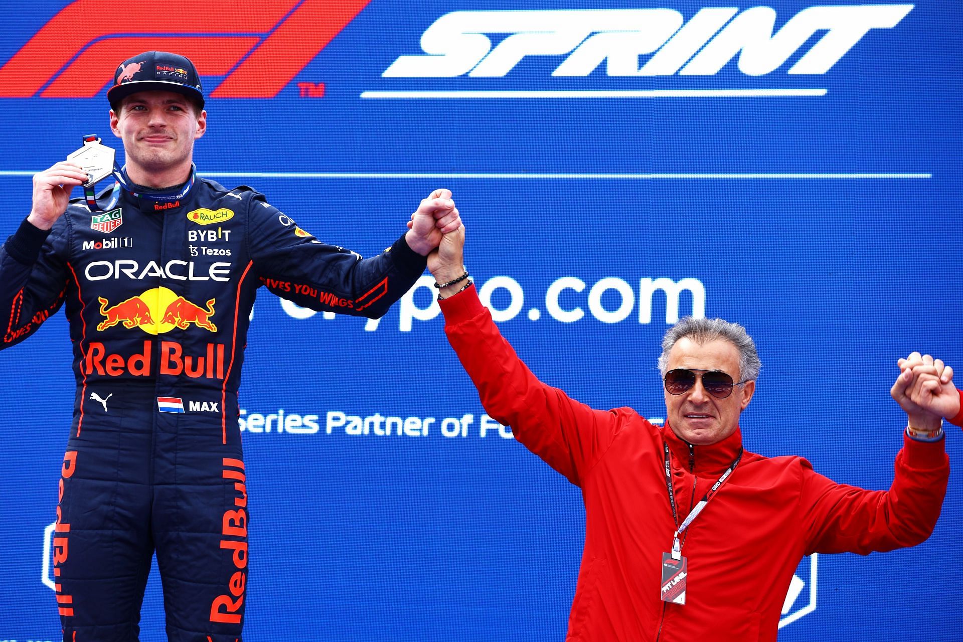 Sprint winner Max Verstappen celebrates with Jean Alesi on the podium at the F1 Grand Prix of Emilia Romagna (Photo by Mark Thompson/Getty Images)