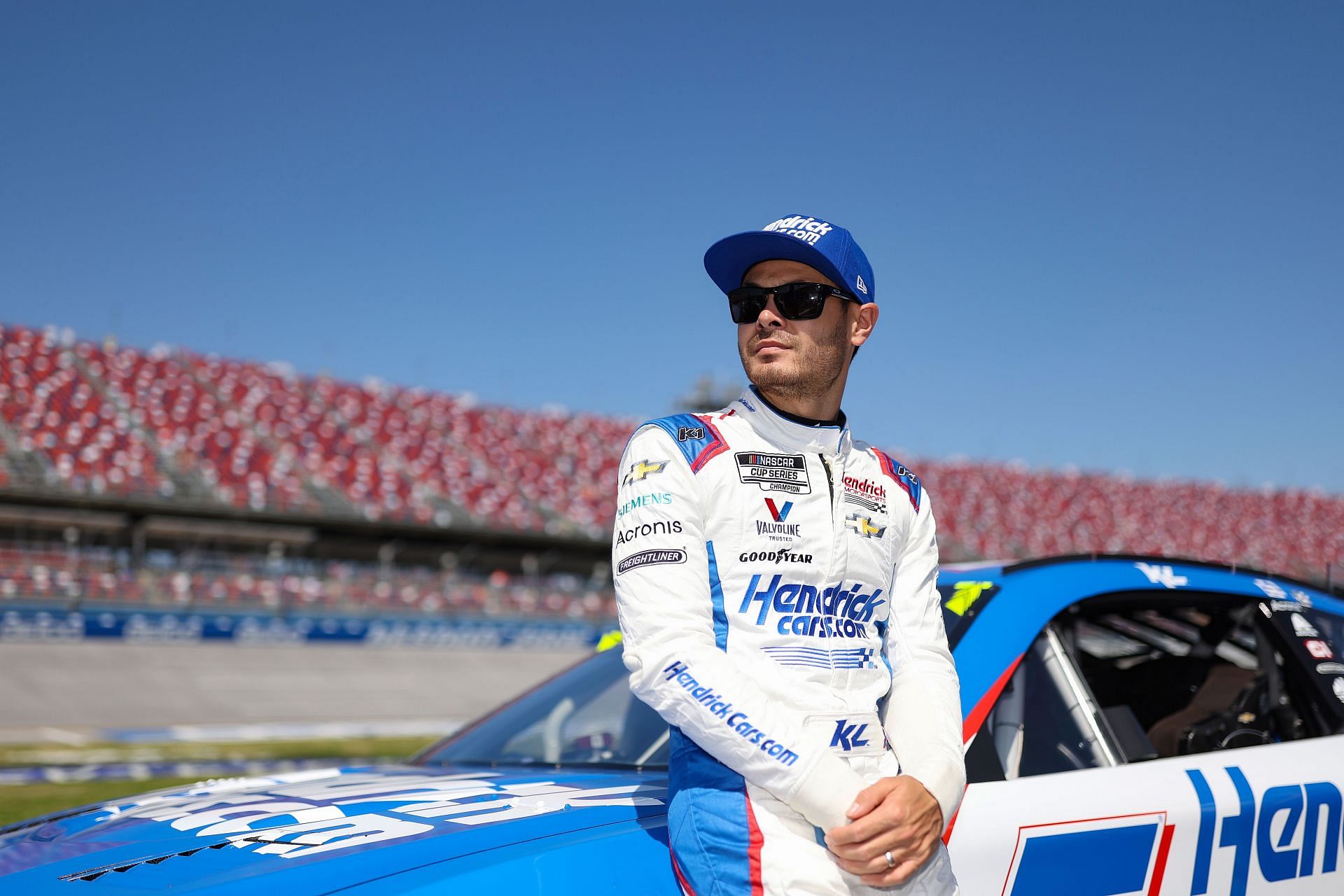Kyle Larson looks on during qualifying for the NASCAR Cup Series GEICO 500 at Talladega Superspeedway