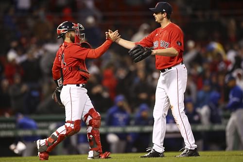 Closer Garrett Whitlock celebrates with catcher Conor Wang after recording his first save of the 2022 season.