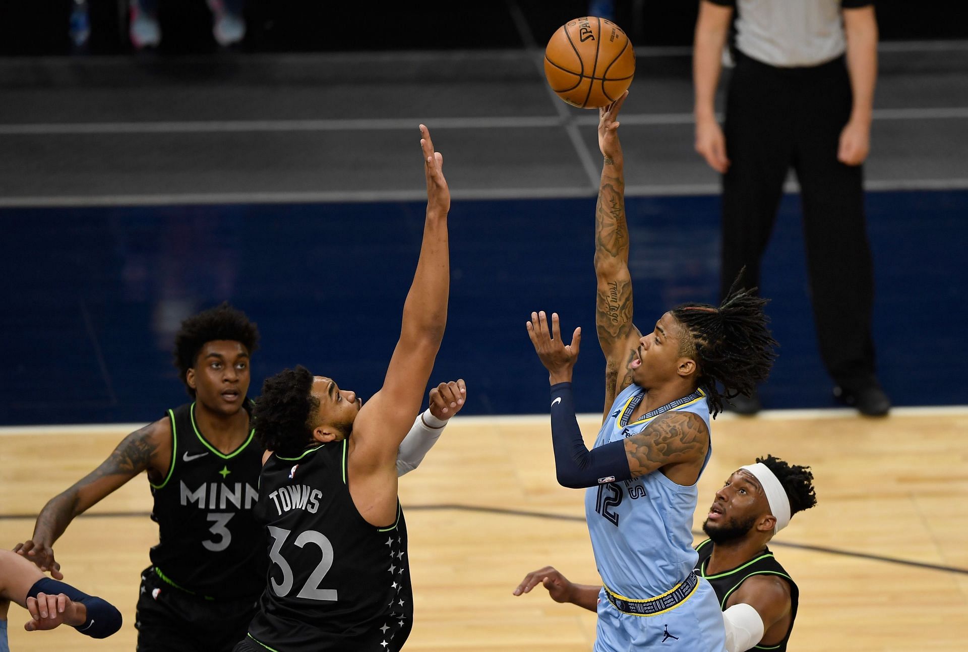 Ja Morant of the Memphis Grizzlies against Karl-Anthony Towns of the Minnesota Timberwolves