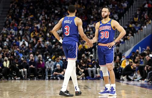 Stephen Curry (30) and Jordan Poole of the Golden State Warriors talk after a play against the Brooklyn Nets on Jan. 29 in San Francisco, California.