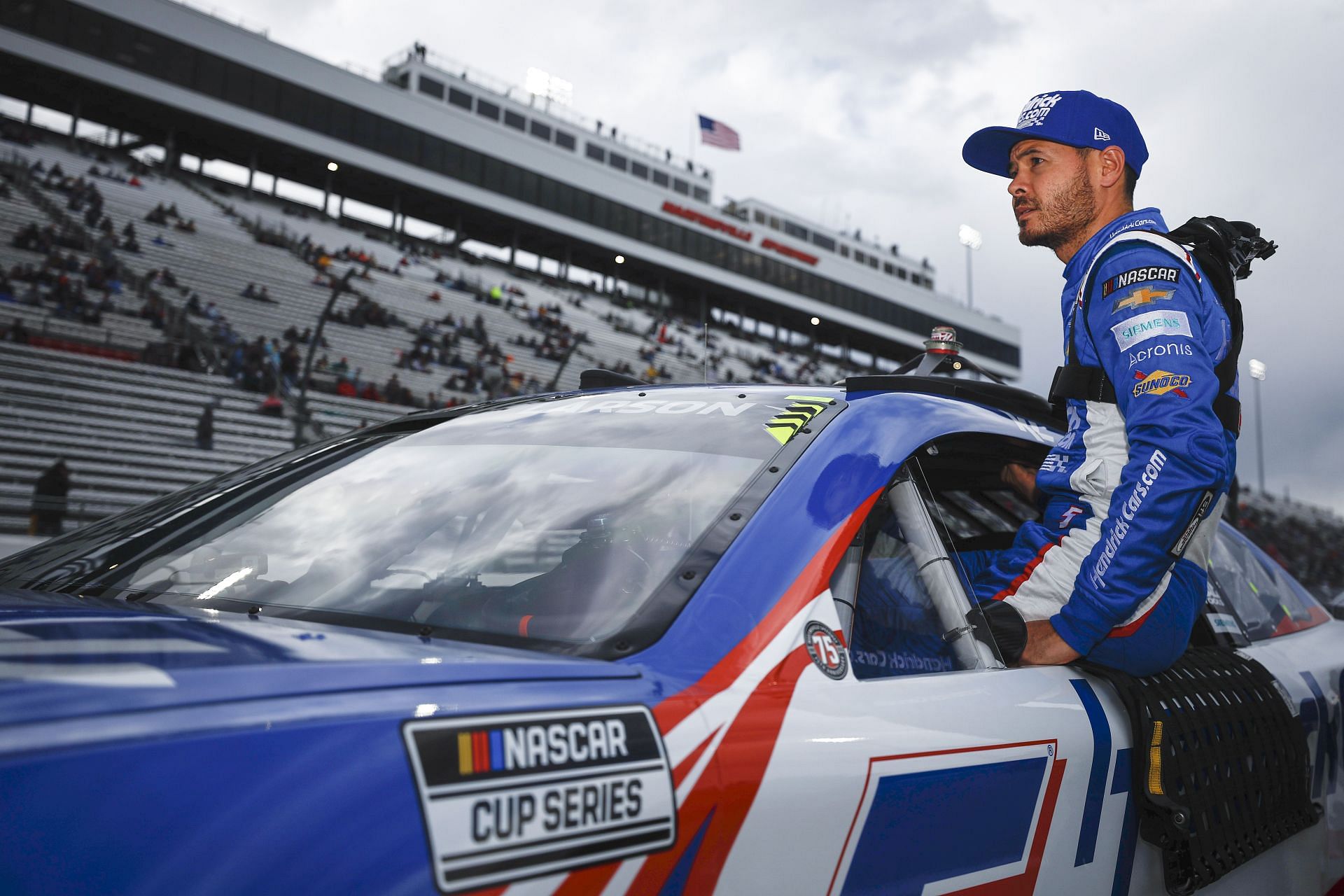 Kyle Larson enters his car during qualifying for the NASCAR Cup Series Blue-Emu Maximum Pain Relief 400 at Martinsville Speedway (Photo by Jared C. Tilton/Getty Images)