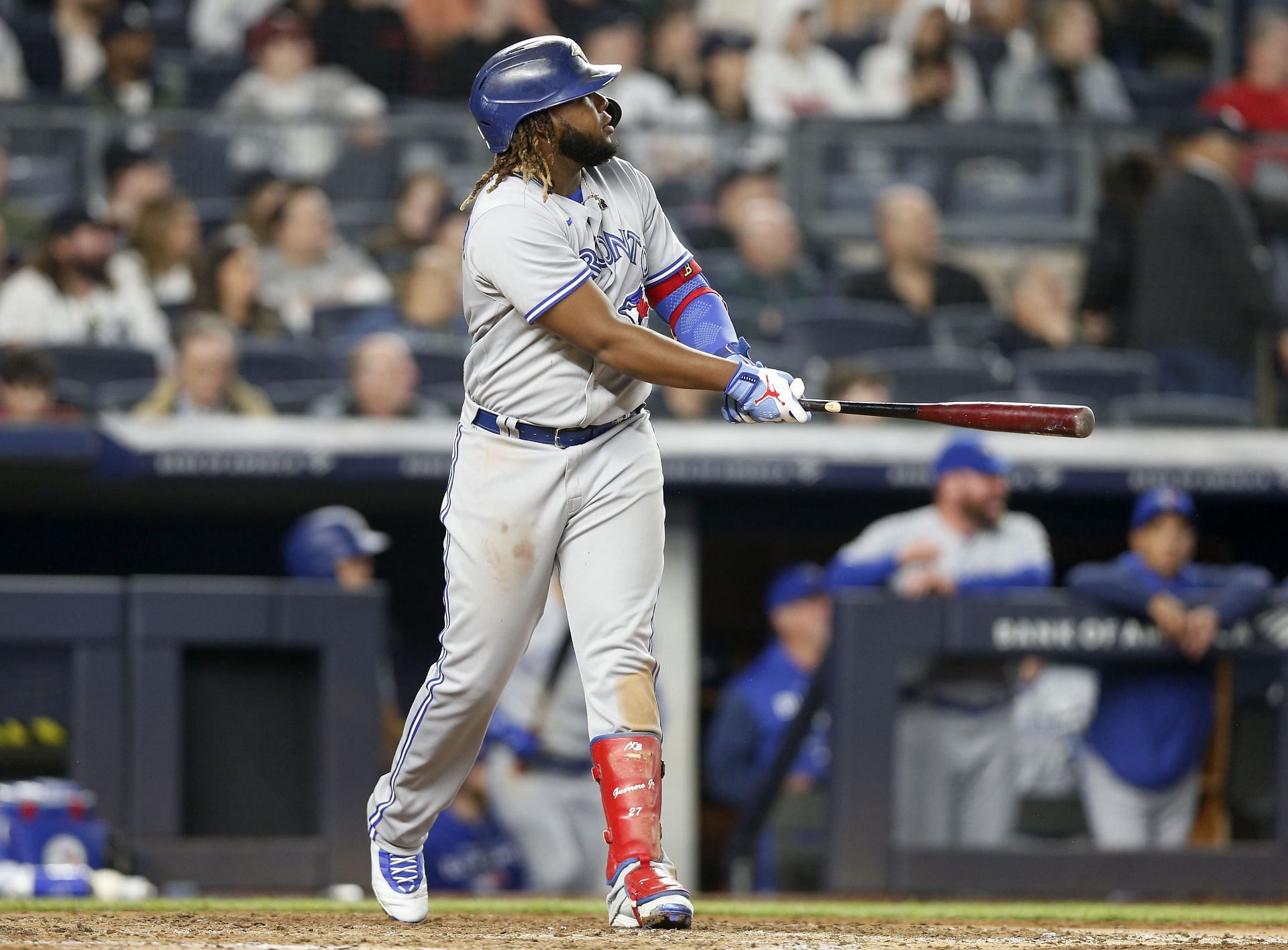 Vladimir Guerrero Jr. watches the flight of his eighth inning home run against the New York Yankees