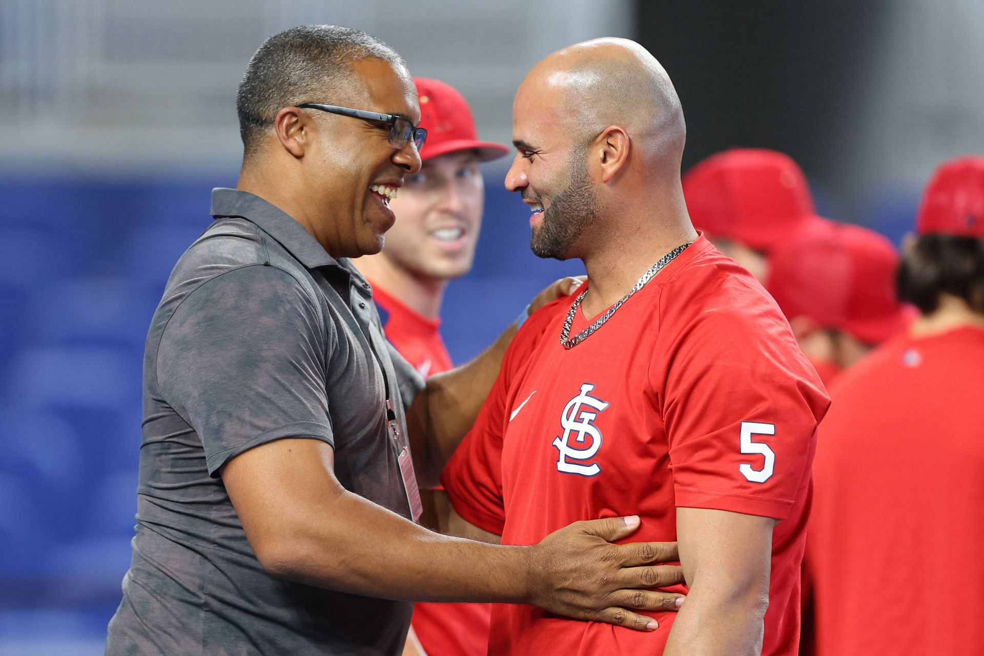 Former teammate and current ESPN MLB Analyst, Eduardo Perez, greets St. Louis Cardinals legend Albert Pujols ahead of their series against the Miami Marlins.
