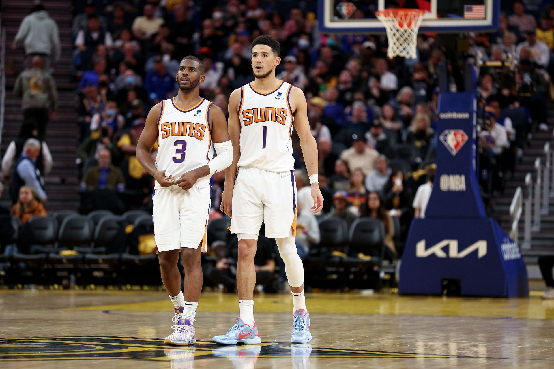 Phoenix Suns v Golden State Warriors; Devin Booker and Chris Paul standing side by side