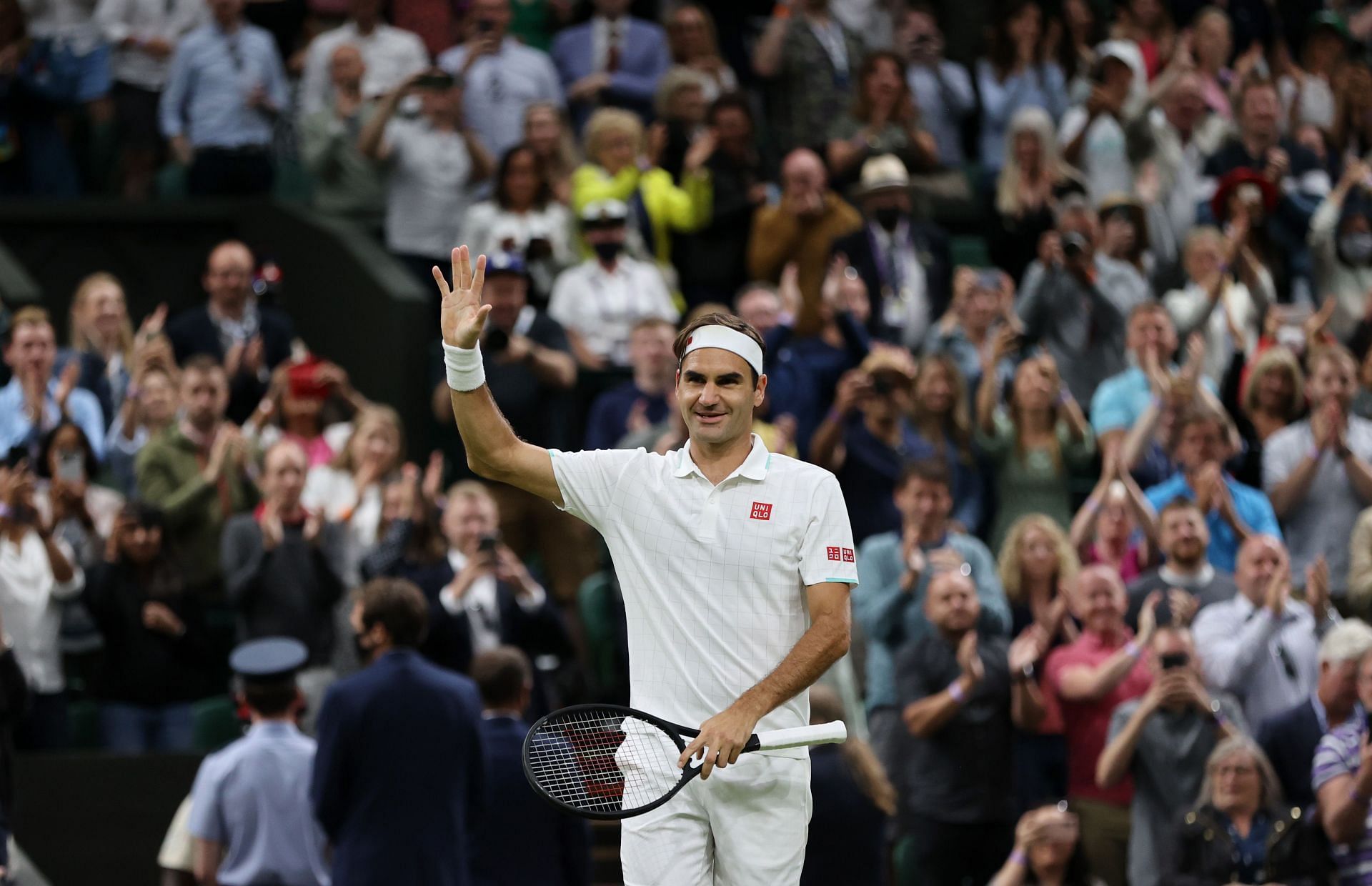 Roger Federer celebrates beating Lorenzo Sonego at the 2021 Wimbledon Championships