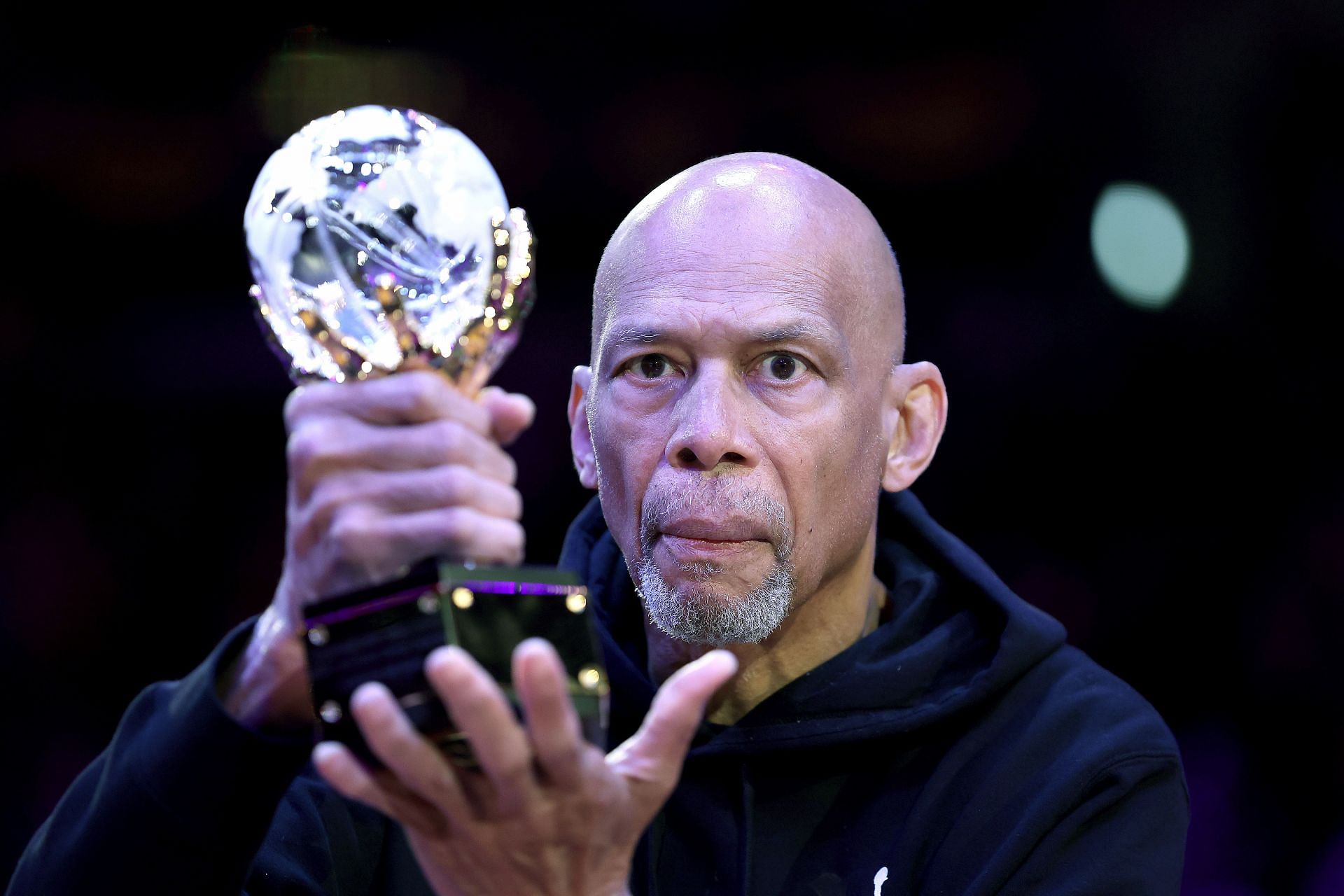Kareem Abdul-Jabbar holds the trophy for the NBA Social Justice Champion award