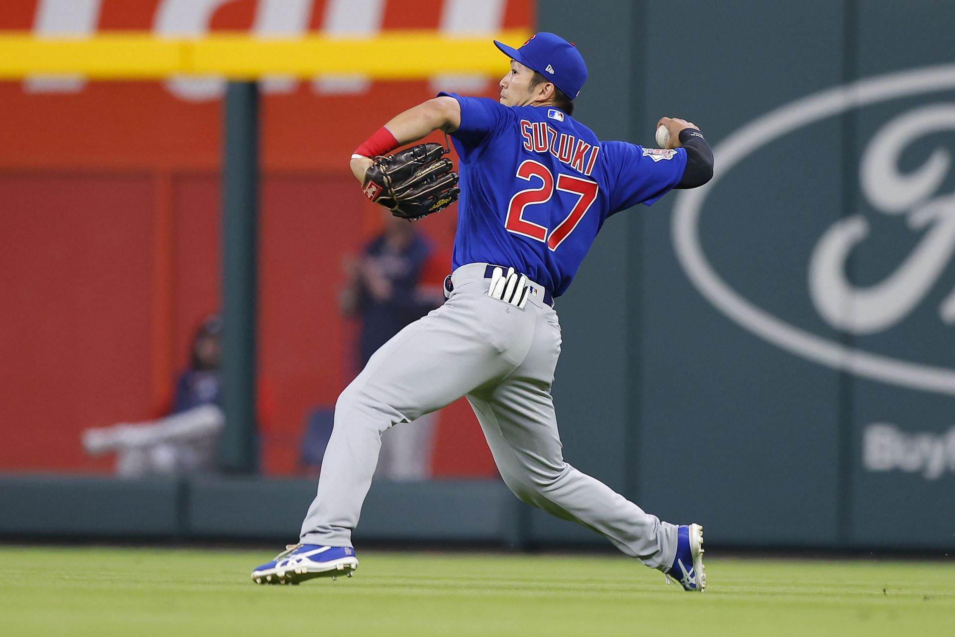 Seiya Suzuki throws a ball back into the infield in a Chicago Cubs v Atlanta Braves game.