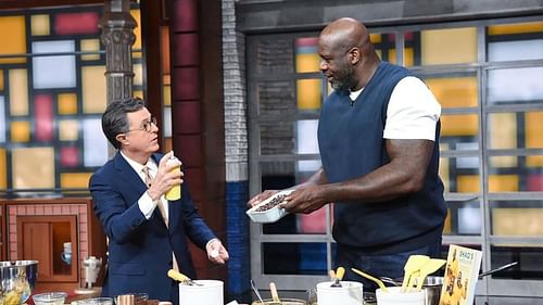 Shaquille O'Neal (left) cooking brownies with Stephen Colbert on the Late Night Show