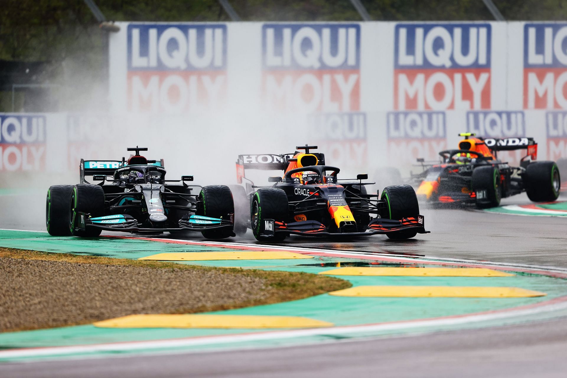 Max Verstappen (#33) Red Bull Racing RB16B and Lewis Hamiton (#44) Mercedes W12 getting their elbows out, 2021 Emilia-Romagna GP