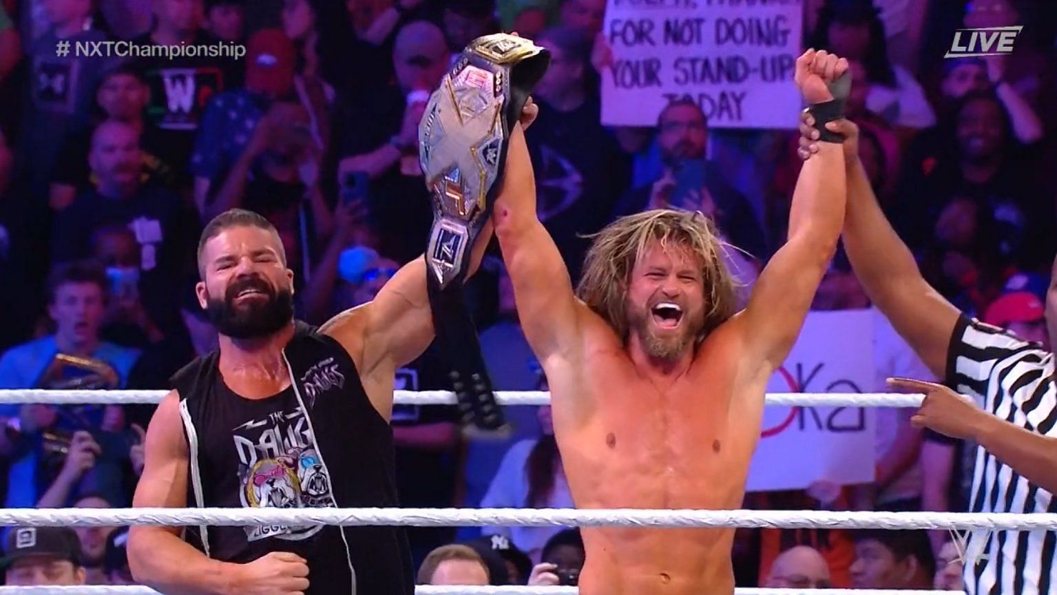Dolph Ziggler celebrates his win with Robert Roode