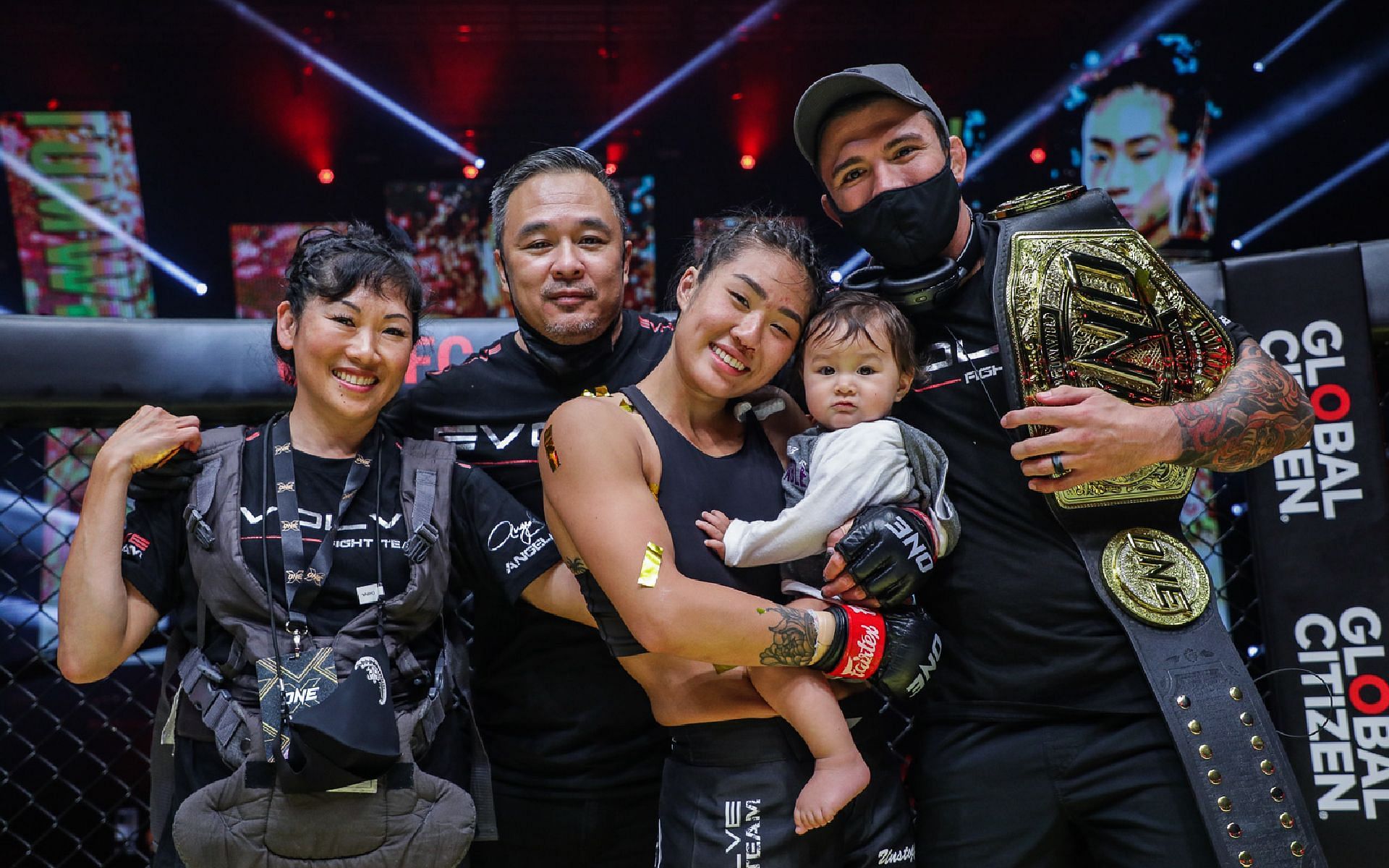 Angela Lee (center) celebrates with her parents Jewelz and Ken (left), her husband Bruno Pucci (right), and daughter Ava Marie at ONE X. [Photo ONE Championship]