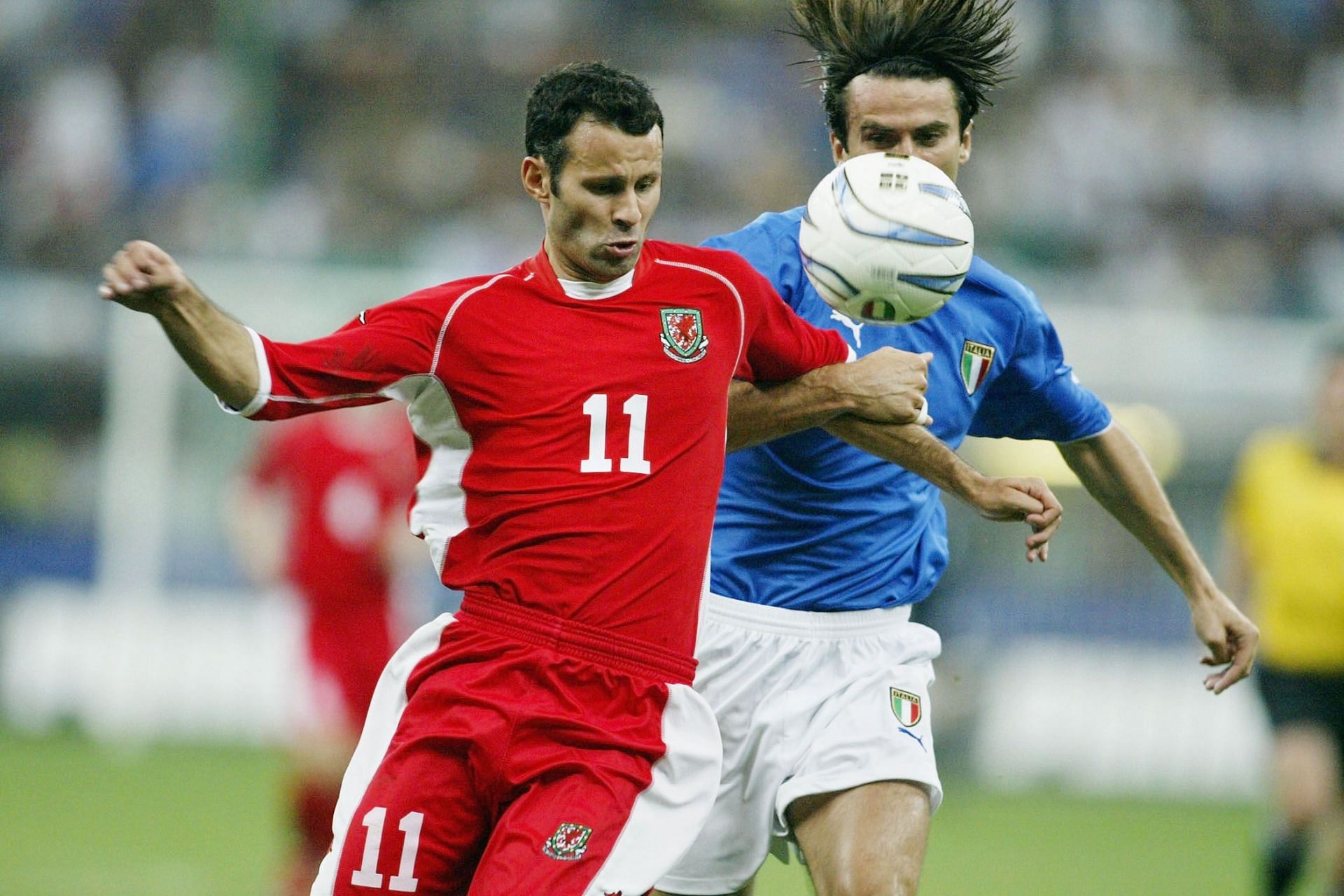 Ryan Giggs of Wales battles with Christian Panucci of Italy