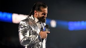 Seth Rollins reacts to being hit with legendary WWE finishing move
