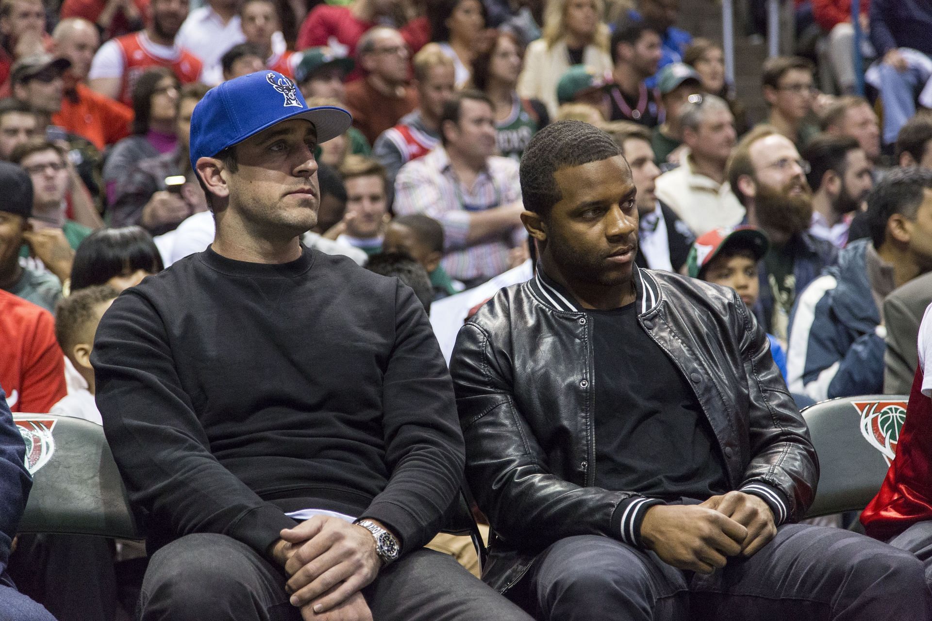 The QB with his Packers teammate, WR Randall Cobb, at a Bucks game