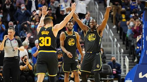 Steph Curry, Andrew Wiggins and Draymond Green of the Golden State Warriors