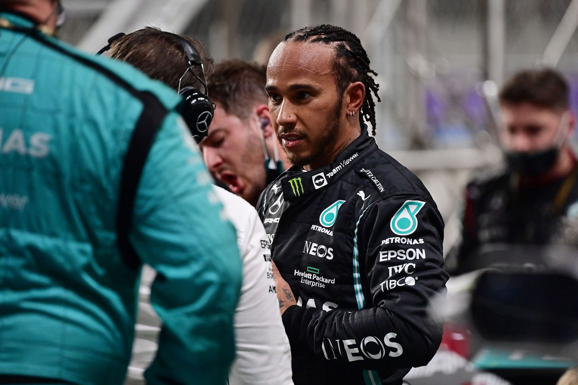 Lewis Hamilton of Great Britain and Mercedes looks on from the pitlane during the F1 Grand Prix of Saudi Arabia at Jeddah Corniche Circuit on December 05, 2021 in Jeddah, Saudi Arabia. (Photo by Andrej Isakovic - Pool/Getty Images)