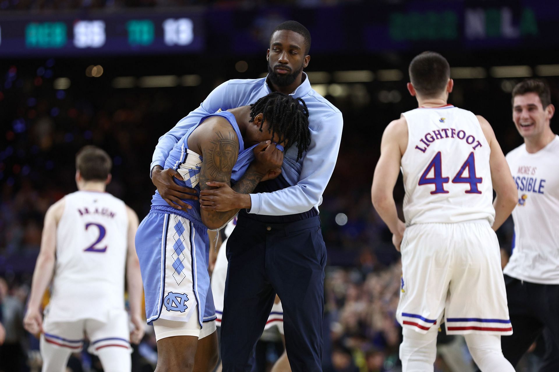 Caleb Love is consoled after missing clutch shots in his team&#039;s loss.