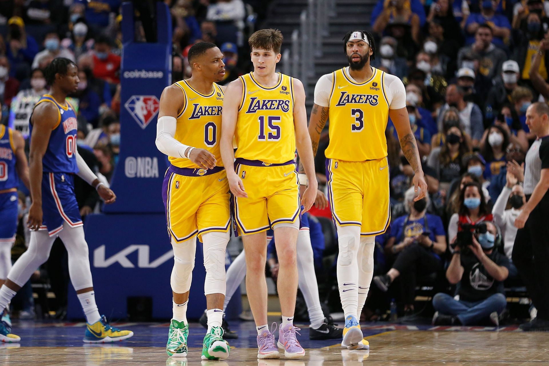 Austin Reaves of the LA Lakers is met by teammates Russell Westbrook and Anthony Davis