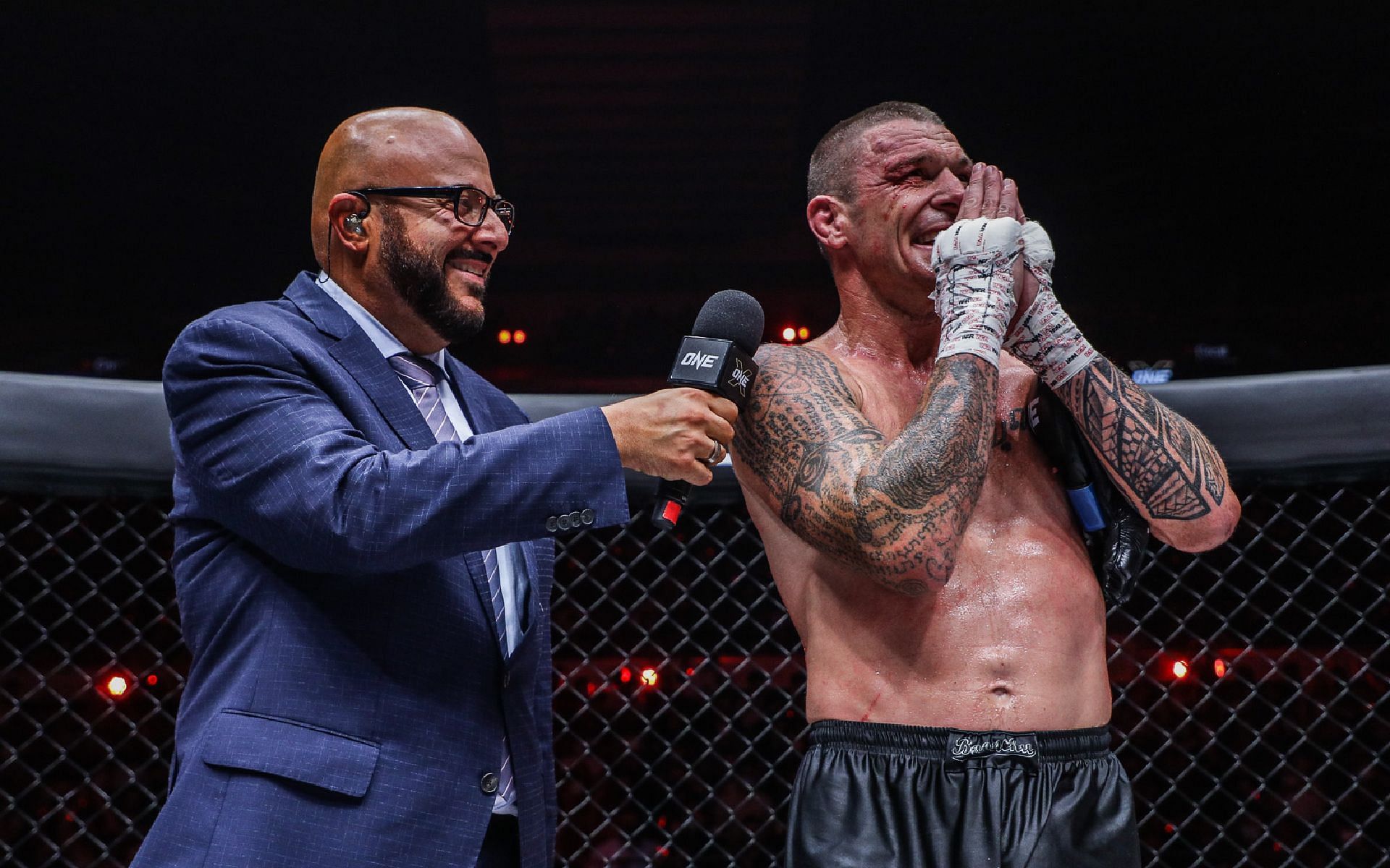 John Wayne Parr (right) celebrates with ONE Championship commentator Michael Schiavello (left) after his farewell fight at ONE X. [Photo ONE Championship]