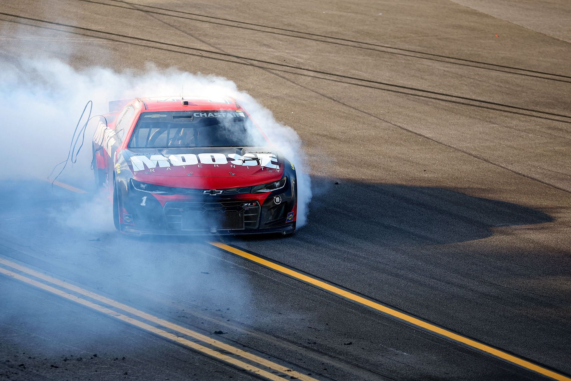 Ross Chastain celebrates with a burnout after winning the NASCAR Cup Series GEICO 500 at Talladega Superspeedway. (Photo by James Gilbert/Getty Images)