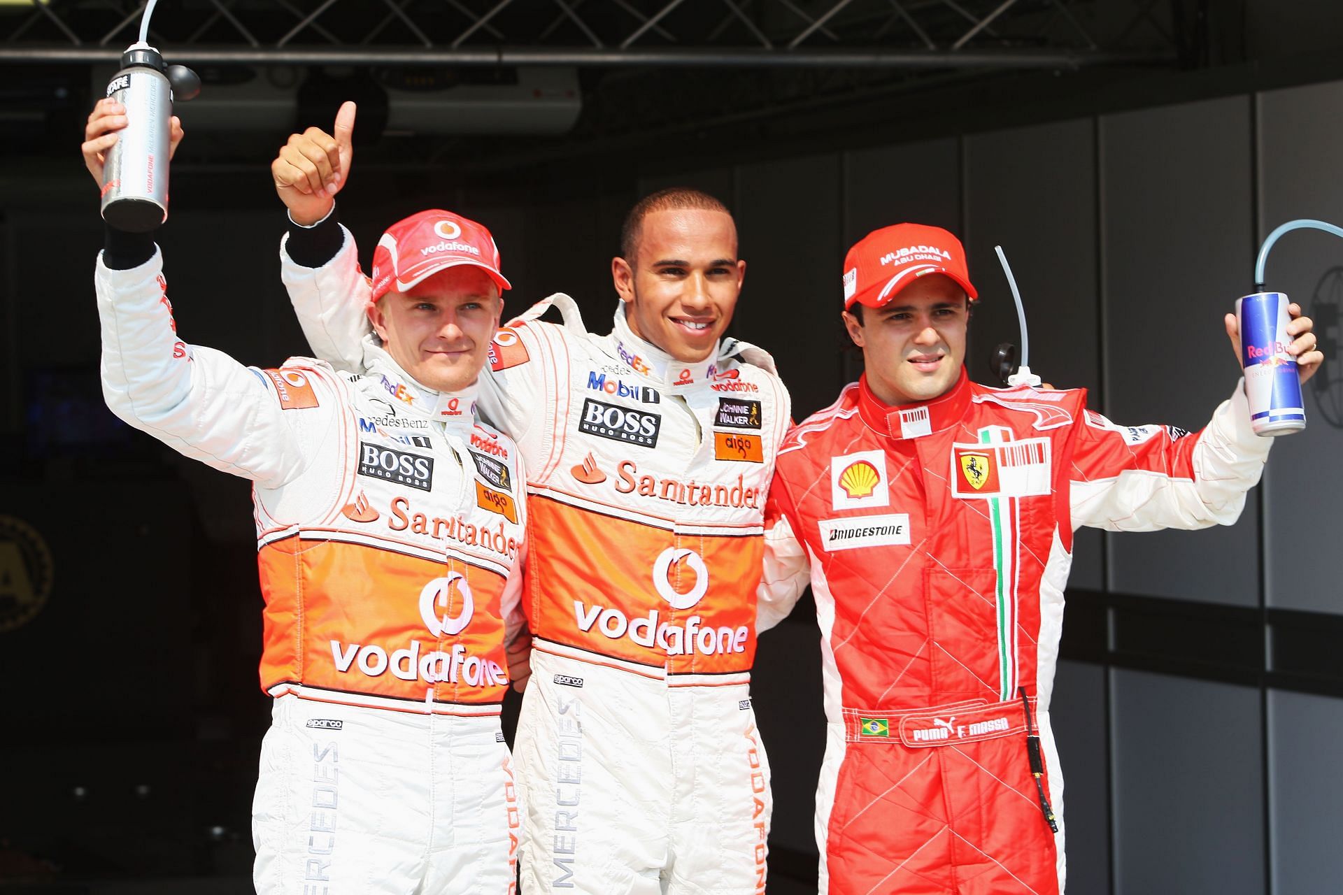 Heikki Kovalainen (left), Lewis Hamilton (center), and Felipe Massa (right) after qualifying for the 2008 Hungarian GP (Photo by Mark Thompson/Getty Images)