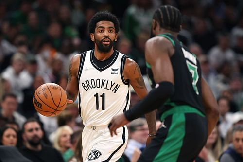 Kyrie Irving surveys the scene vs. the Celtics' Jaylen Brown in Game 1.