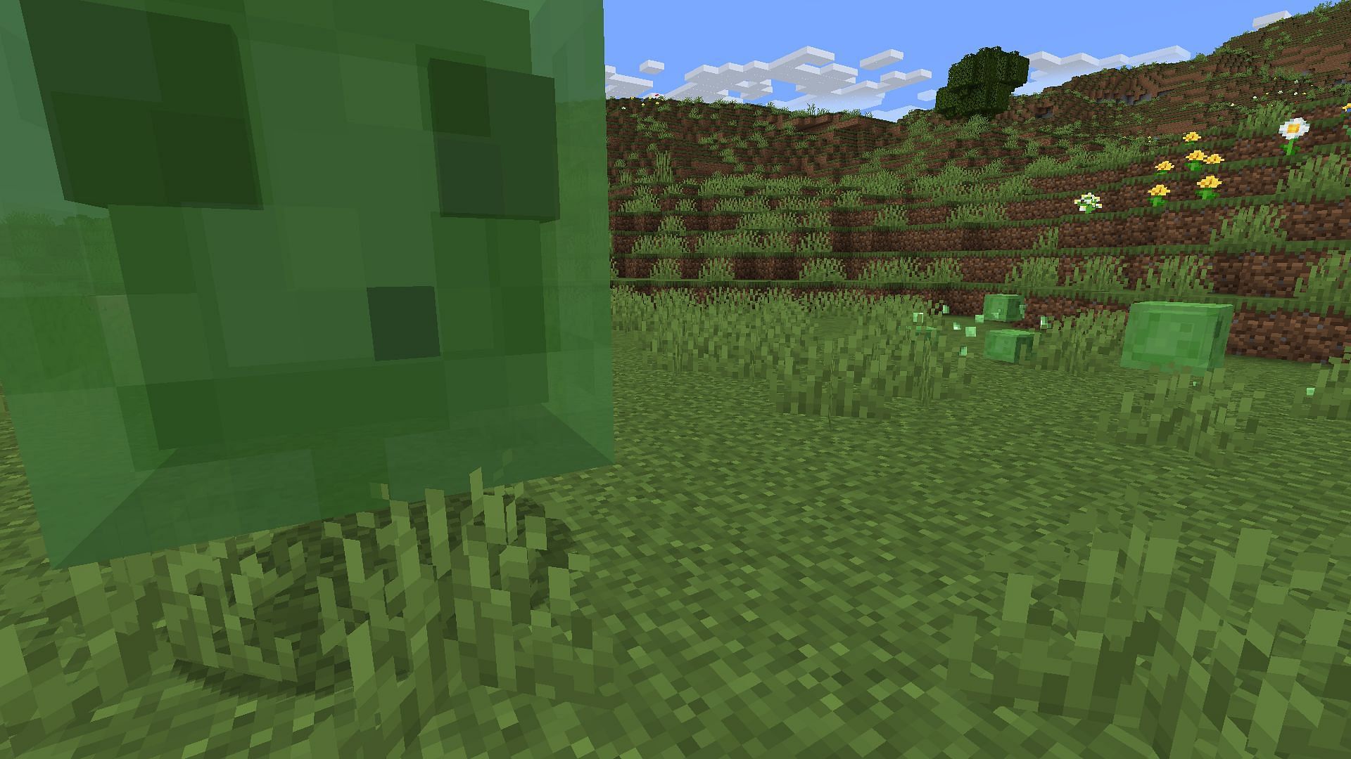 Slimes in a field (Image via Minecraft)