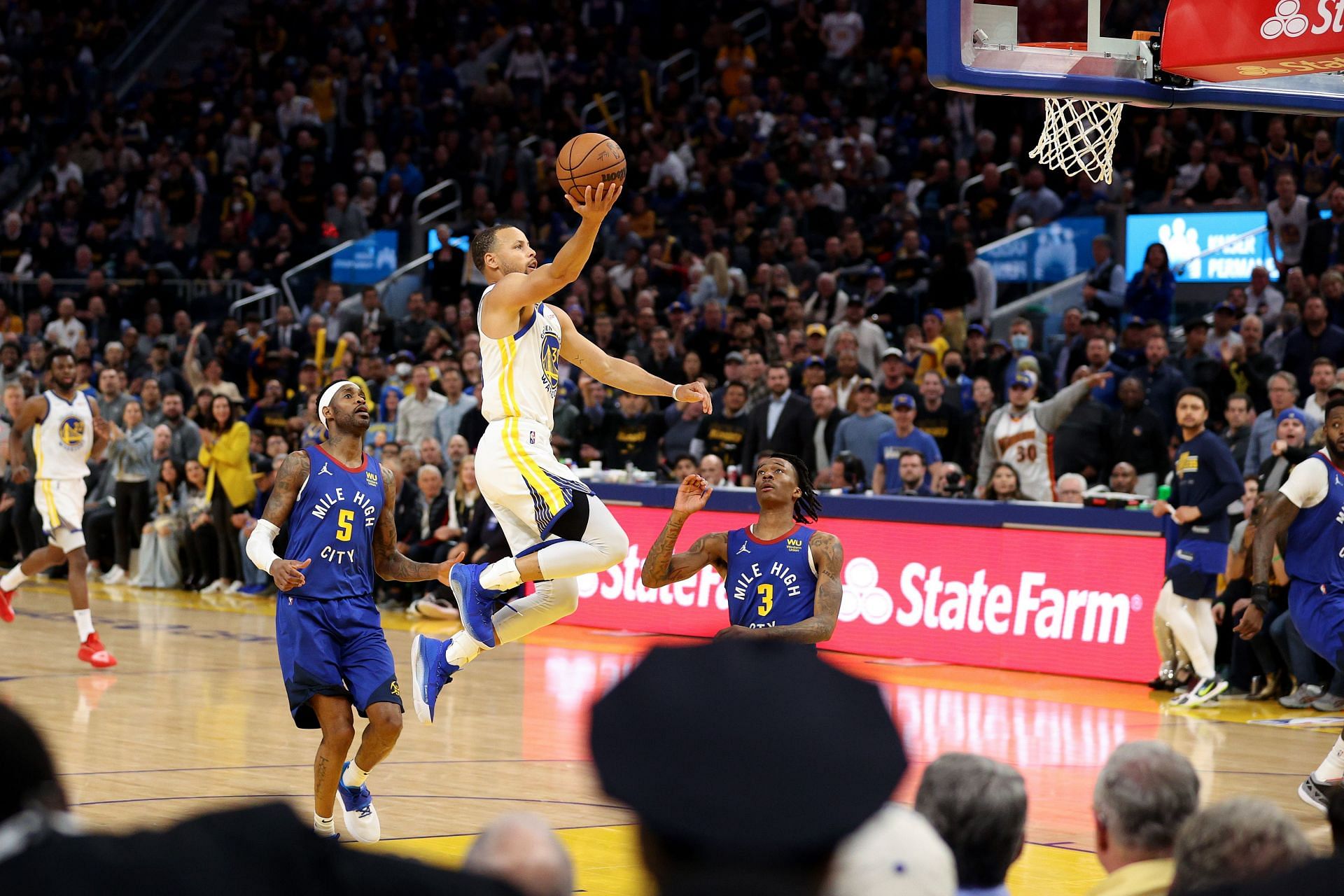 Steph Curry attempts to score off a layup