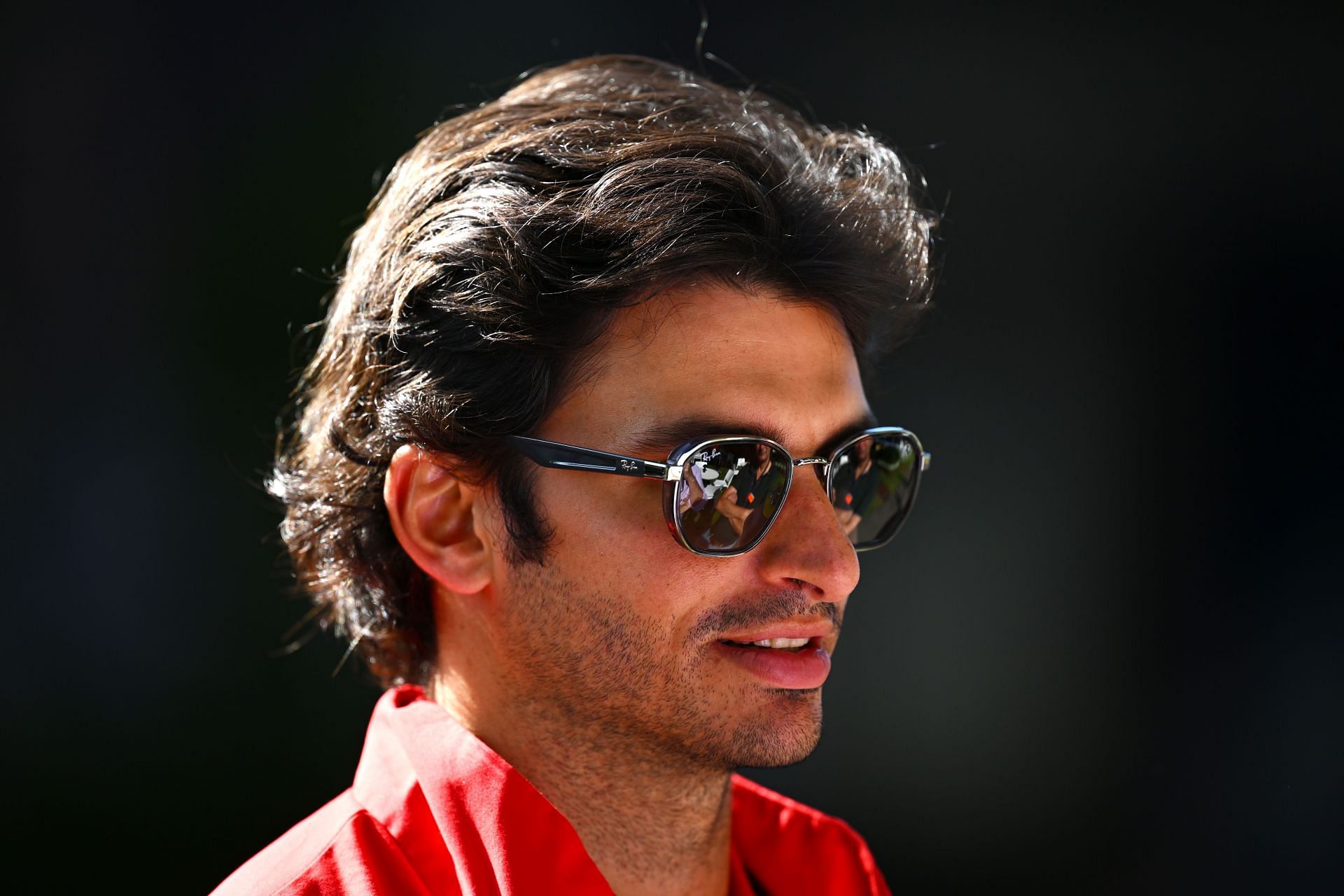 Carlos Sainz of Spain and Ferrari looks on in the Paddock prior to practice ahead of the F1 Grand Prix of Australia at Melbourne Grand Prix Circuit on April 08, 2022 in Melbourne, Australia. (Photo by Clive Mason/Getty Images)