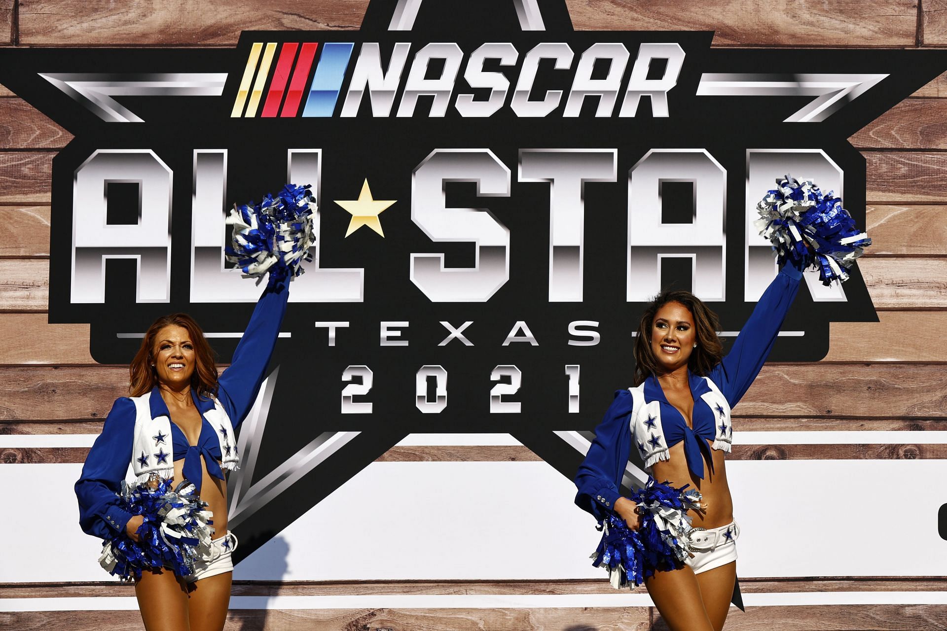 The Dallas Cowboys cheerleaders perform during pre-race ceremonies prior to the NASCAR All-Star Race at Texas Motor Speedway