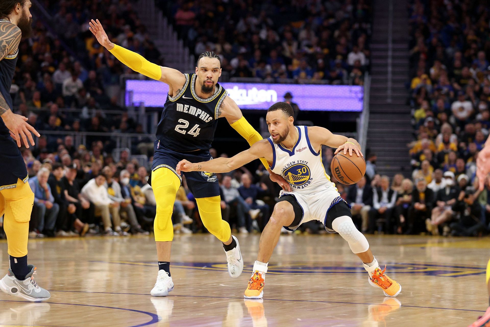 Steph Curry of the Golden State Warriors is guarded by Dillon Brooks of the Memphis Grizzlies