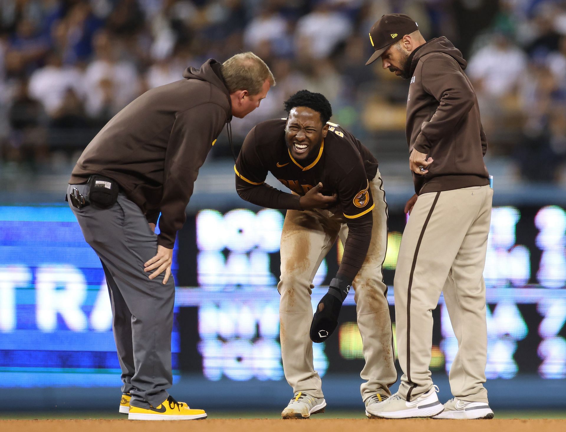 Jurickson Profar of the San Diego Padres reacts to an injury to Jayce Tingler.