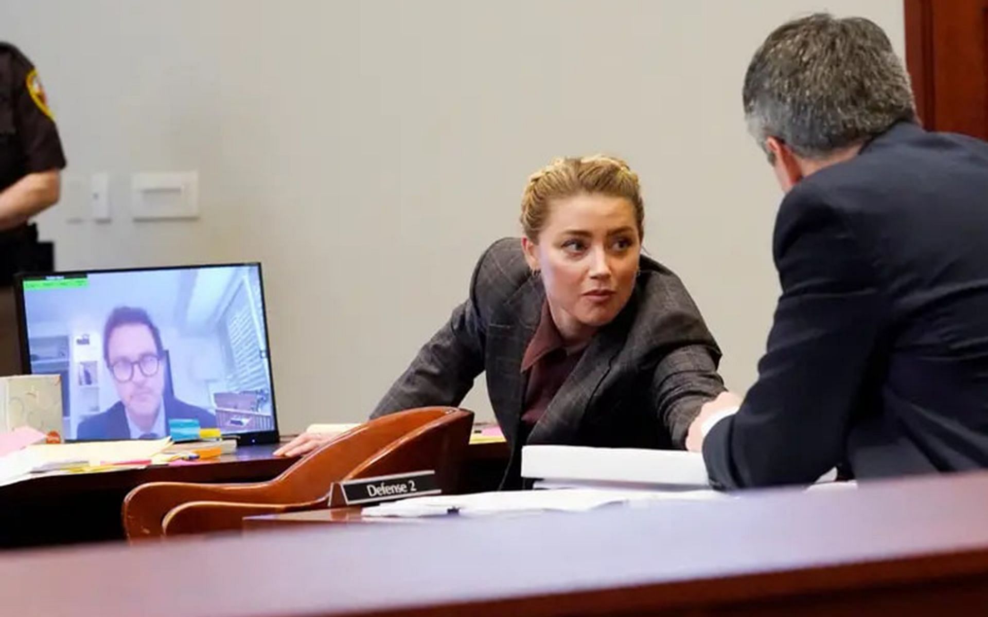 Jack Whigham seen on a monitor while Heard talks to her lawyer (Image by Steve Helber/ Pool via REUTERS)