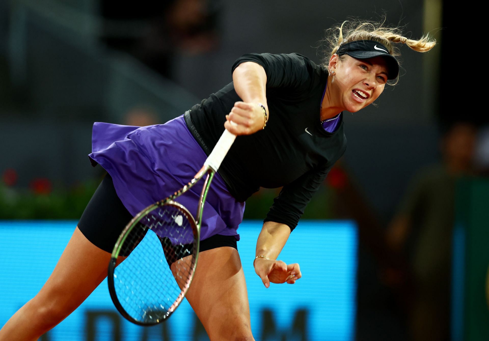 Anisimova serves at the Madrid Open