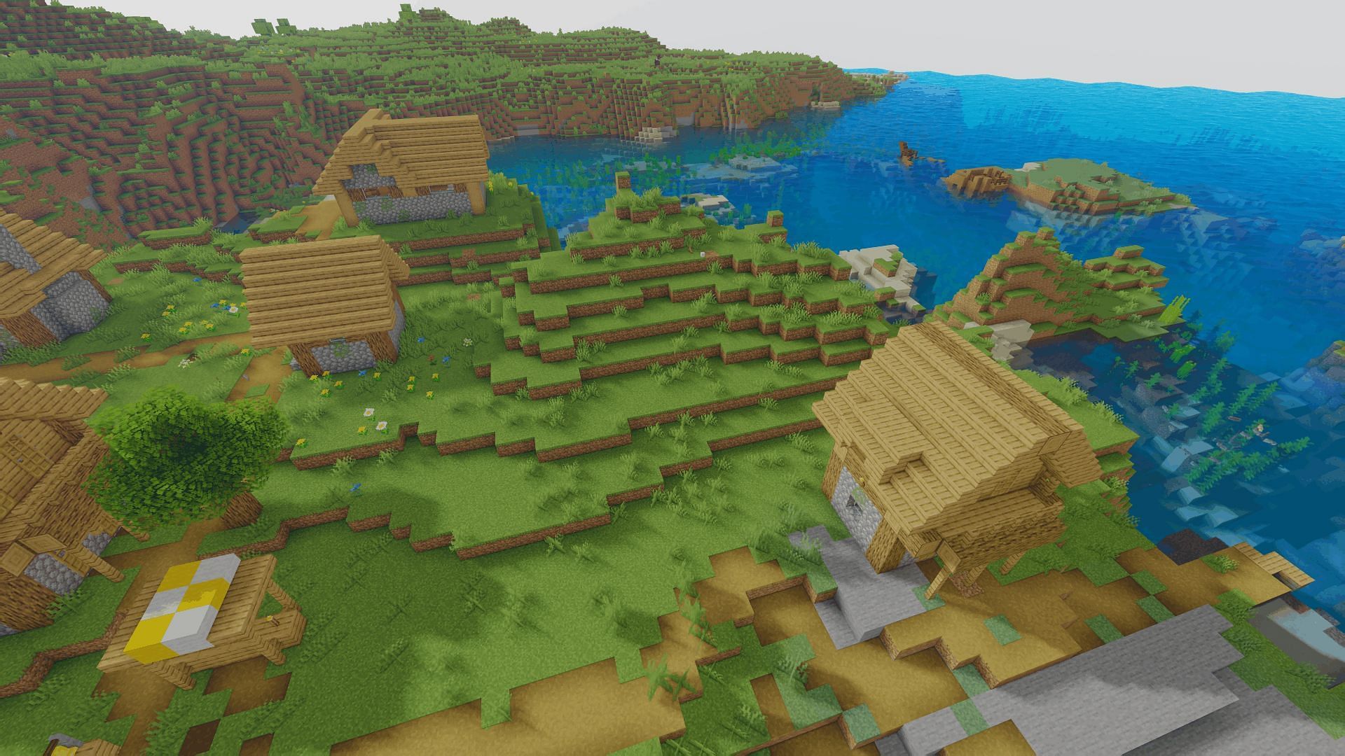 A coastal village with the Oceano shader (Image via Minecraft)