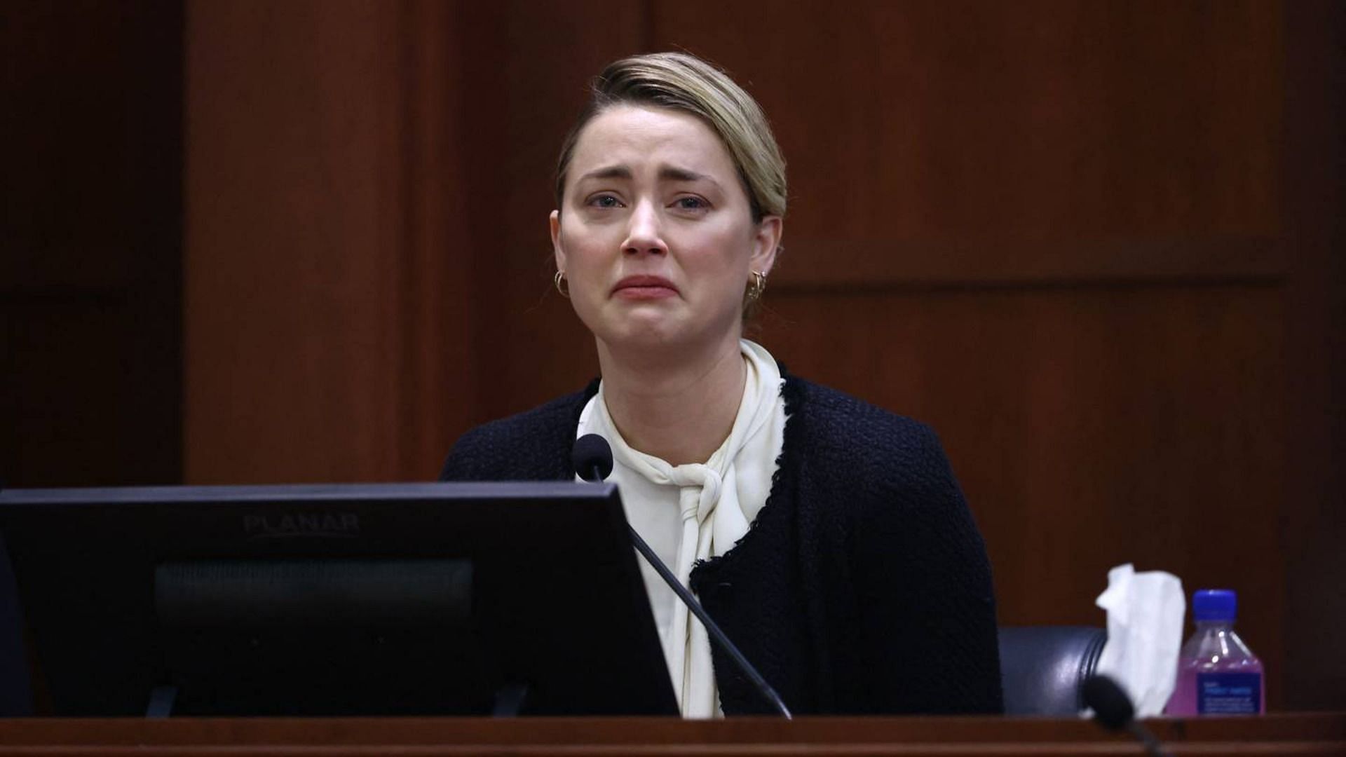 Amber Heard has been falsely accused by Twitterati of using film dialogue during her trial (Image via Jim Lo Scalzo/Getty Images)